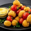 Куриные мячики с томатами черри с сырным соусом